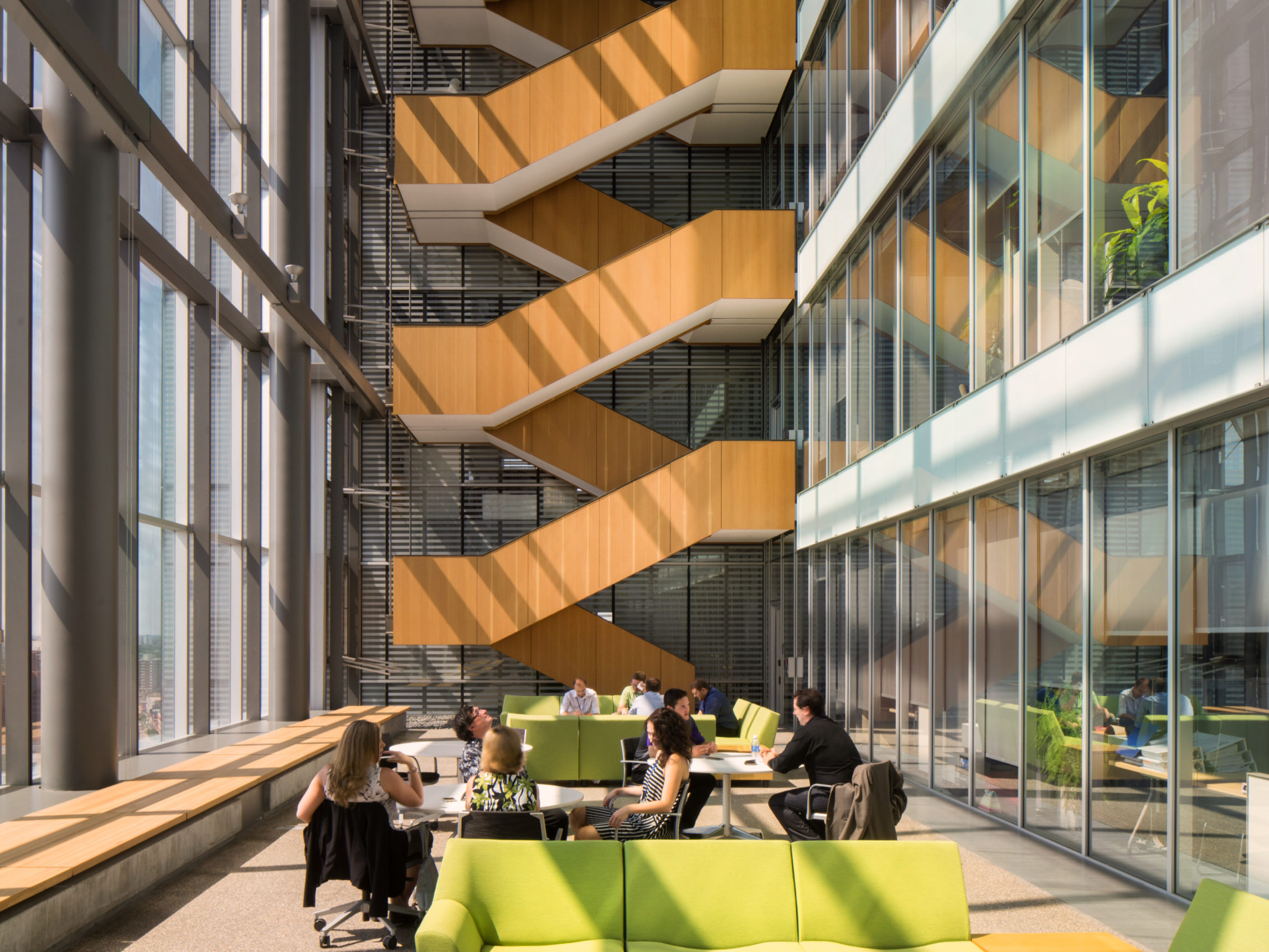 An interior image of an office building that uses passive ventilation strategies for thermal resilience.