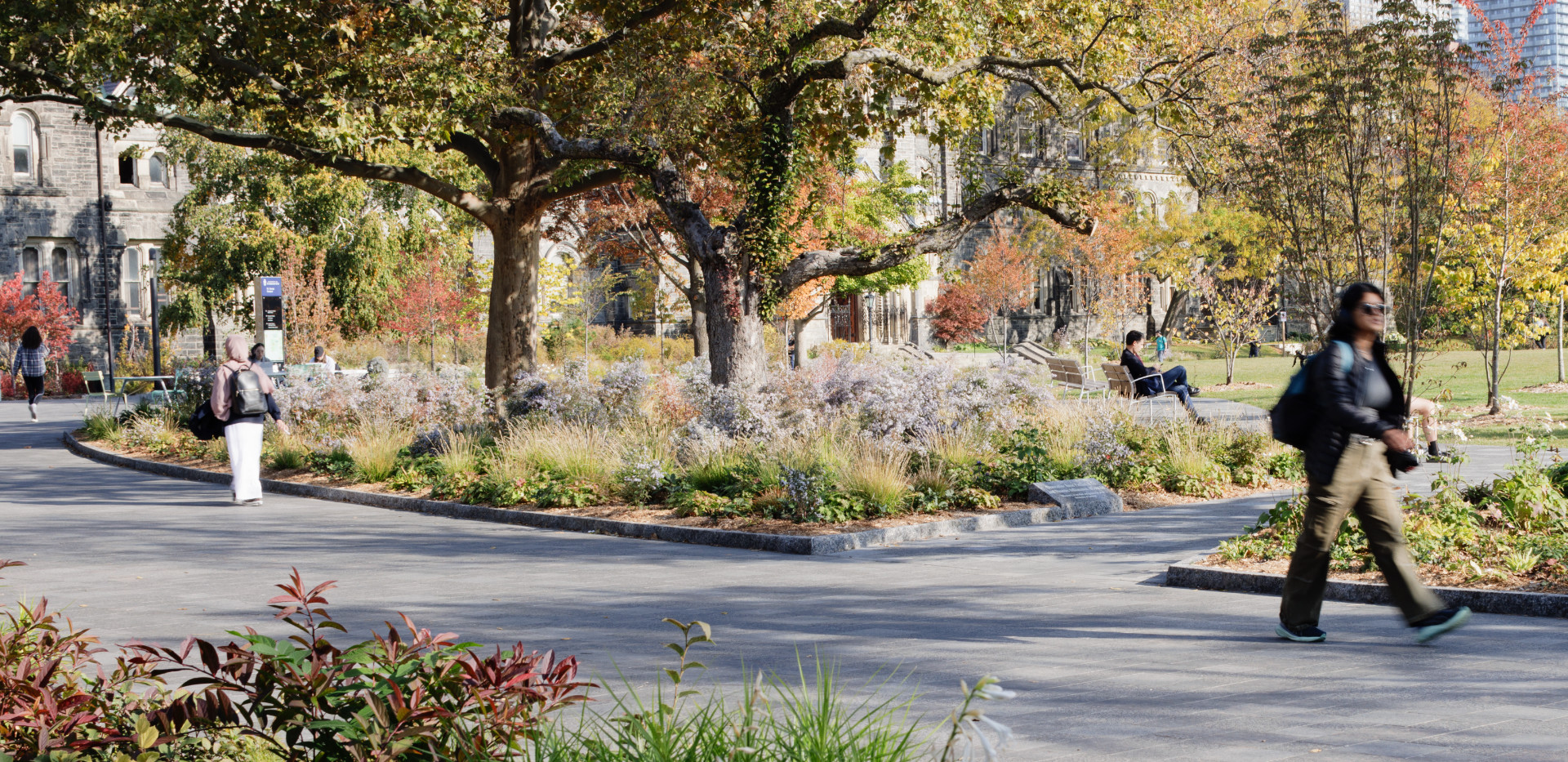 Pedestrians walking around King's College Circle